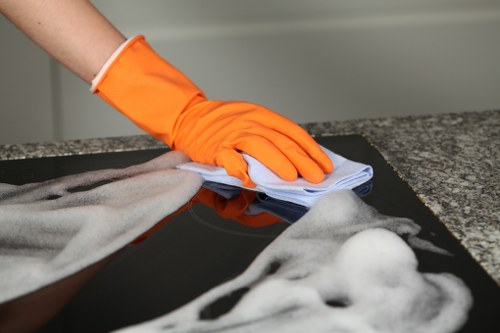 Technician preventing slip hazards during wet carpet cleaning