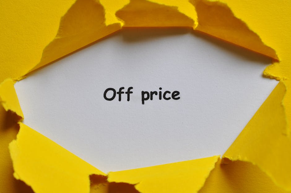 A torn yellow paper background revealing a white inner paper with the handwritten message 'Off price' in black ink. The torn edges of the yellow paper create a jagged frame around the message, suggest